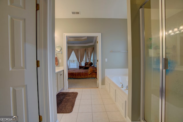 bathroom with tile patterned flooring, vanity, separate shower and tub, and ornamental molding