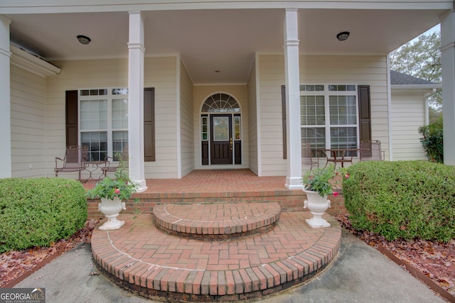 doorway to property with a porch