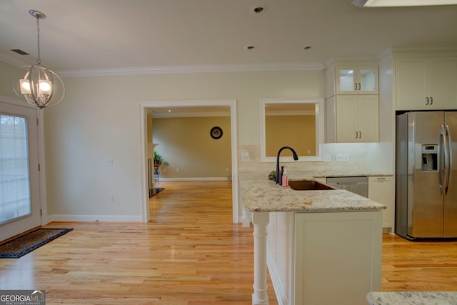 kitchen featuring stainless steel appliances, light hardwood / wood-style floors, and sink