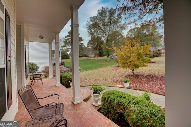 view of patio featuring a porch