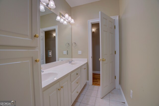 bathroom with tile patterned floors and vanity