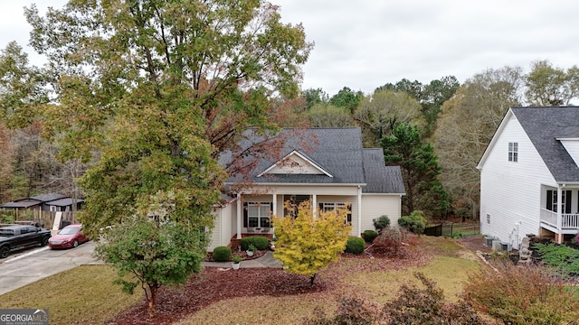 view of front of home with central AC and a porch