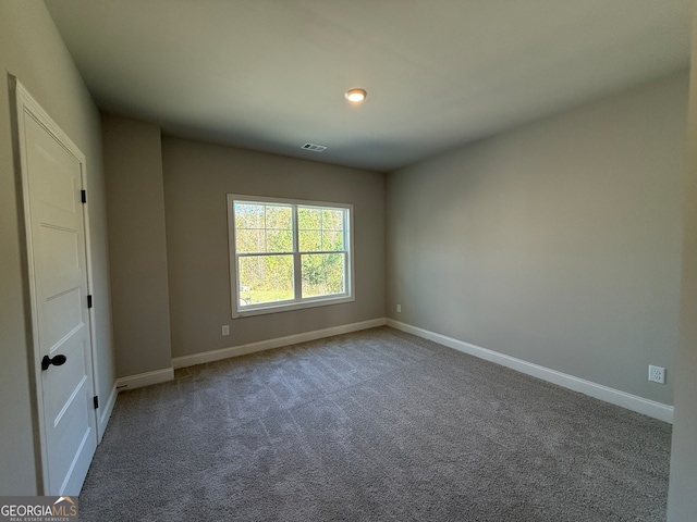 unfurnished room with carpet floors