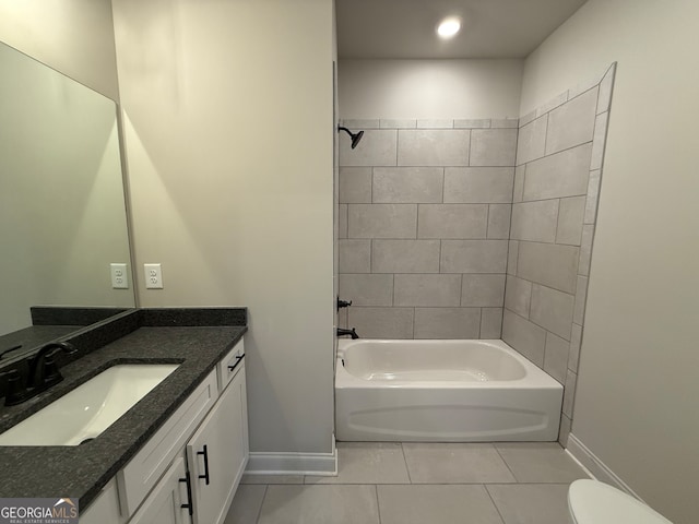 full bathroom with tile patterned flooring, vanity, toilet, and tiled shower / bath