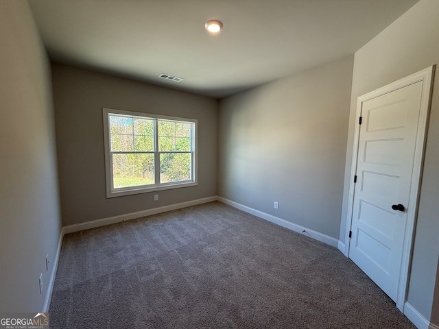 view of carpeted spare room