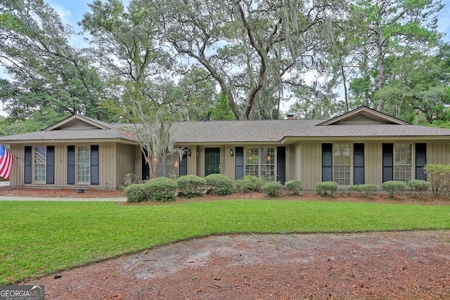 ranch-style house with a front lawn