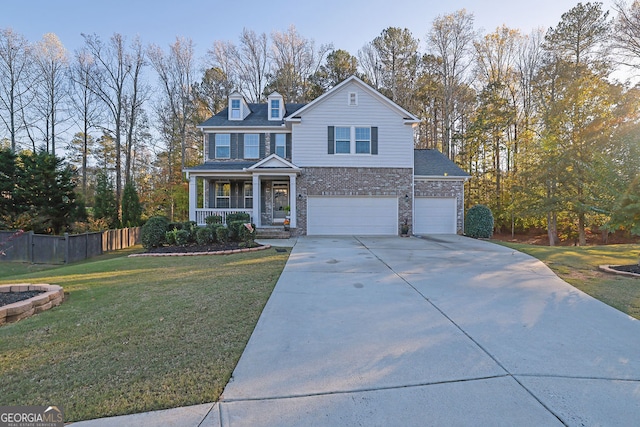 front facade with a front lawn, a porch, and a garage