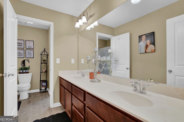 bathroom with tile patterned floors, vanity, and toilet