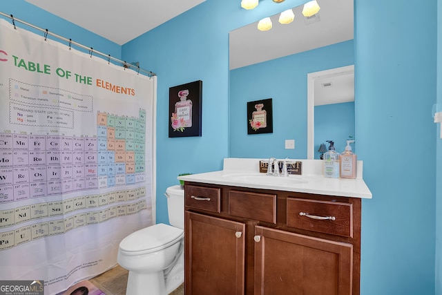 bathroom with tile patterned flooring, vanity, toilet, and a shower with shower curtain