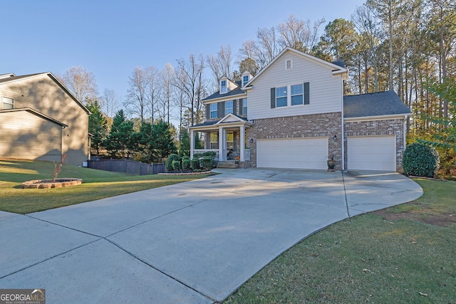 front of property featuring a garage and a front lawn