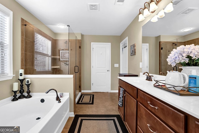 bathroom with tile patterned floors, vanity, and independent shower and bath