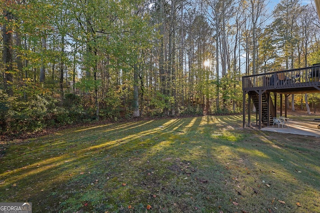 view of yard with a wooden deck