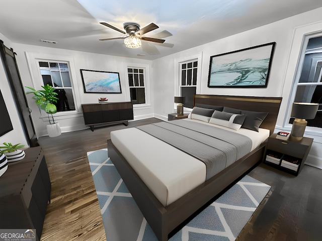 bedroom with dark hardwood / wood-style flooring and ceiling fan