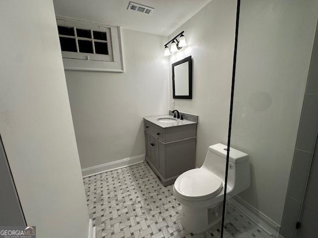 bathroom with vanity and toilet