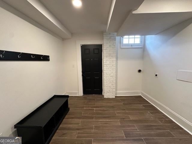 basement with dark hardwood / wood-style flooring