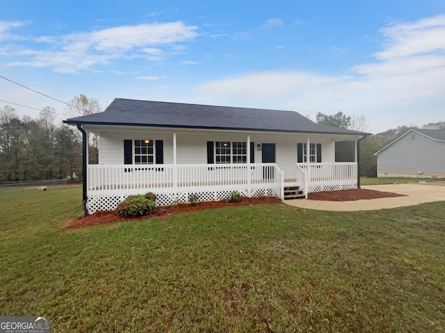 ranch-style house with a front lawn and covered porch