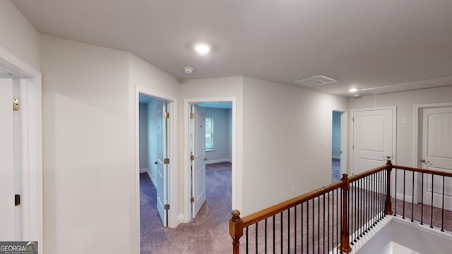 corridor featuring carpet floors