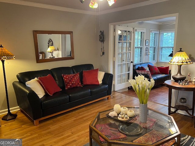 living room featuring crown molding and hardwood / wood-style flooring