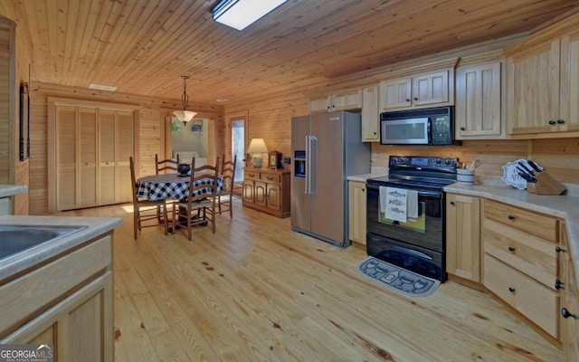 kitchen featuring light hardwood / wood-style flooring, decorative light fixtures, black appliances, wooden walls, and wood ceiling