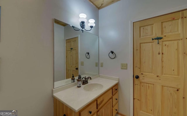 bathroom featuring vanity and an inviting chandelier