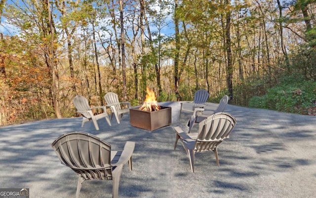 view of patio with a fire pit