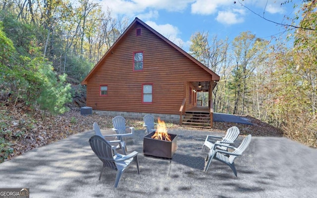 view of patio / terrace featuring an outdoor fire pit