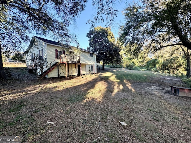 view of yard with a wooden deck