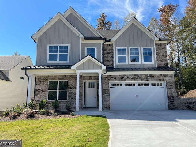 view of front of property with a garage and a front yard