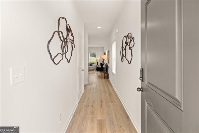 hall with light wood-type flooring