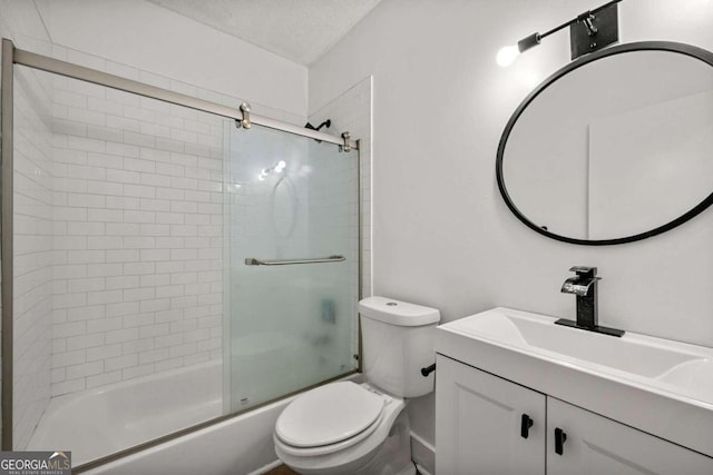 full bathroom with vanity, toilet, a textured ceiling, and combined bath / shower with glass door