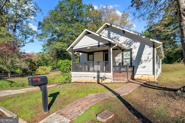 bungalow-style house featuring a front yard and a porch