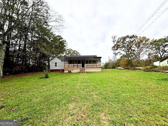 view of yard with a sunroom