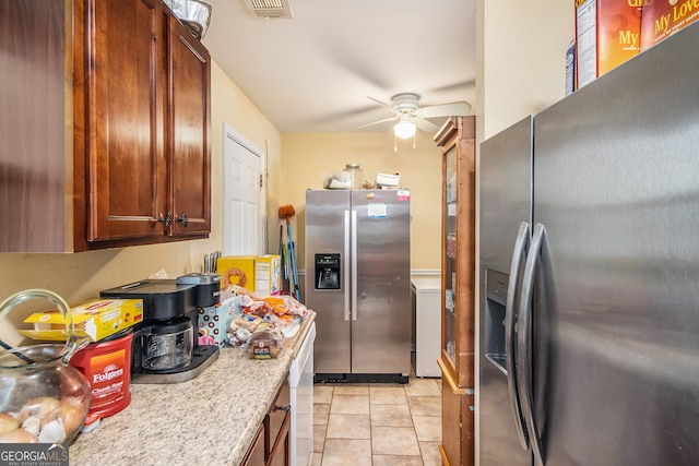 kitchen featuring ceiling fan, stainless steel fridge with ice dispenser, and light tile patterned floors