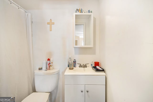 bathroom with vanity and toilet