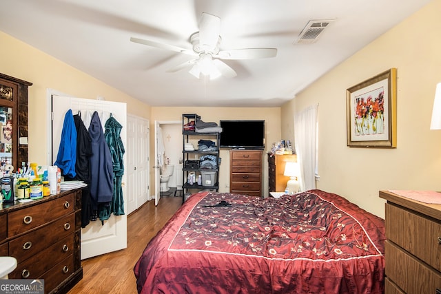 bedroom with ceiling fan and hardwood / wood-style flooring