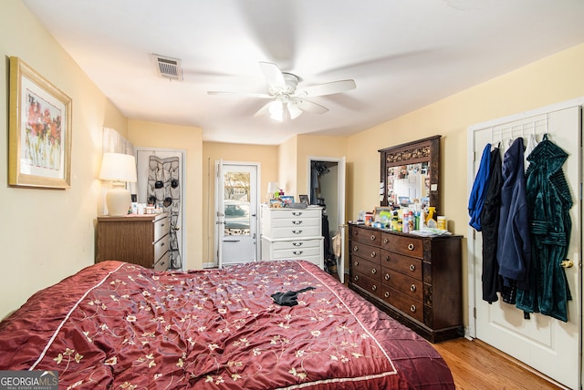 bedroom with ceiling fan and light hardwood / wood-style floors