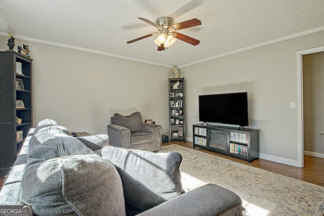 living room featuring hardwood / wood-style floors, a textured ceiling, ceiling fan, and ornamental molding