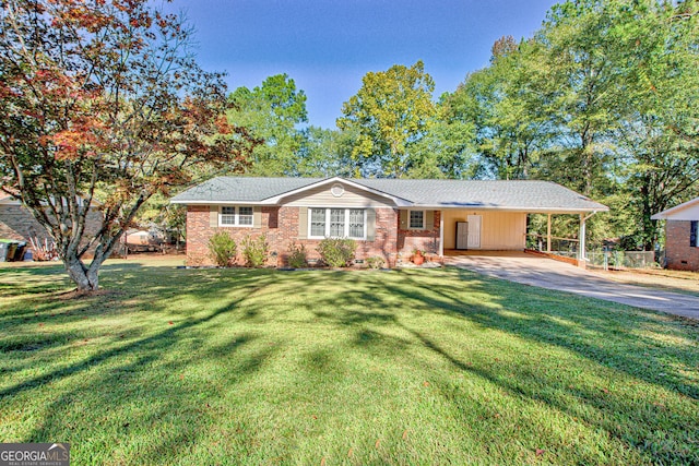 ranch-style home featuring a front yard and a carport