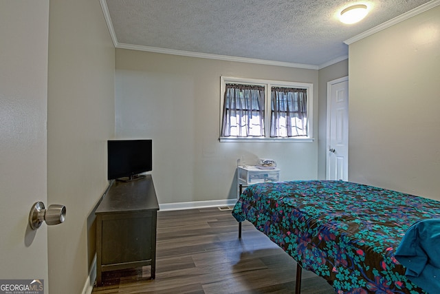 bedroom with a textured ceiling, dark hardwood / wood-style floors, and crown molding