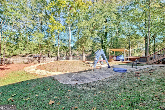 view of jungle gym featuring a lawn