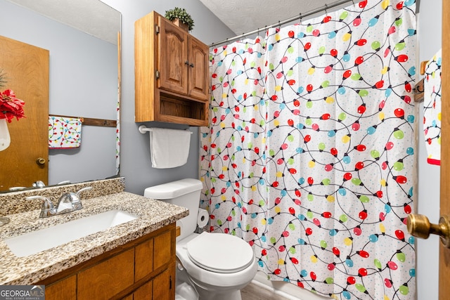 bathroom featuring vanity, a textured ceiling, hardwood / wood-style flooring, toilet, and curtained shower