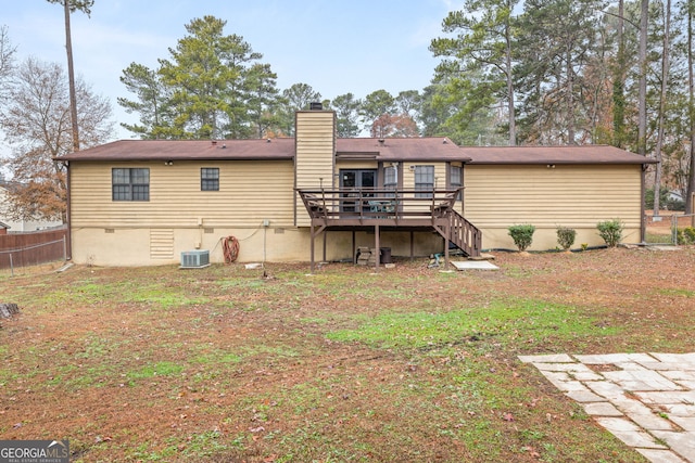 rear view of house featuring central AC unit and a deck