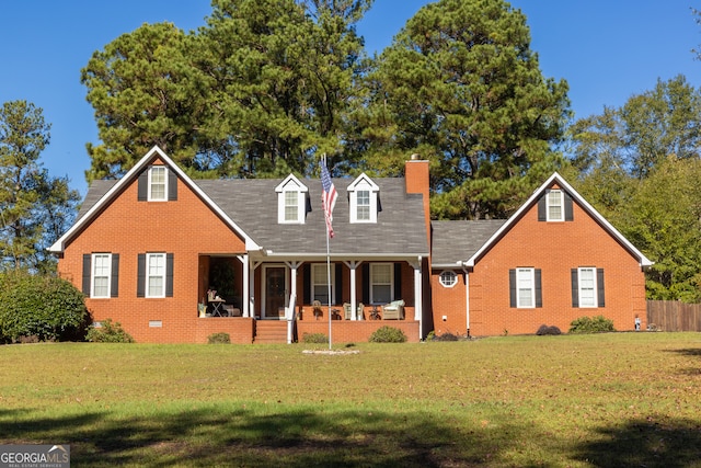 cape cod home featuring a front lawn and covered porch