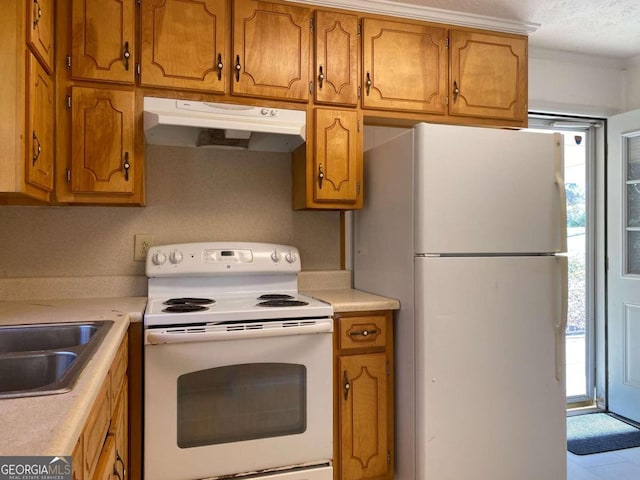 kitchen with sink and white appliances