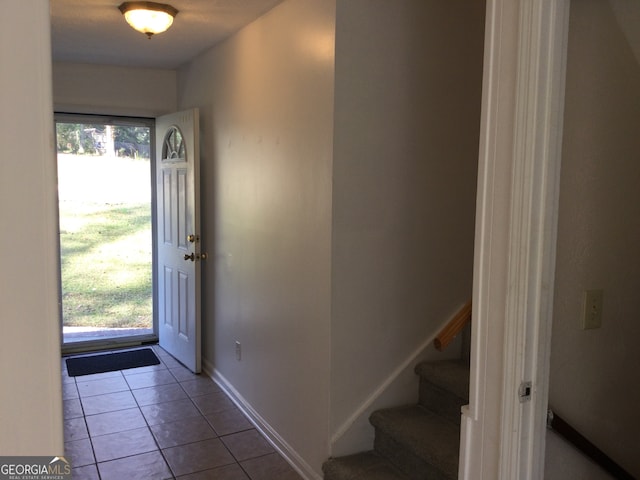 foyer entrance featuring light tile patterned floors