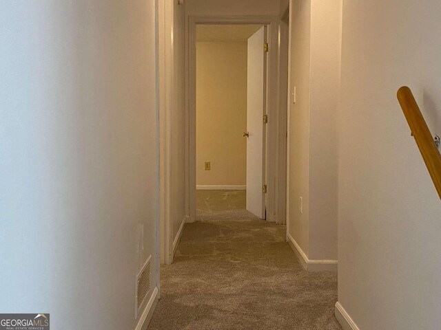 hallway with carpet