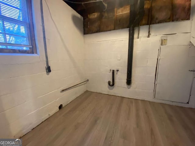 basement with wood-type flooring