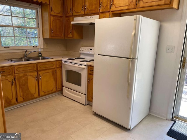 kitchen with white appliances and sink