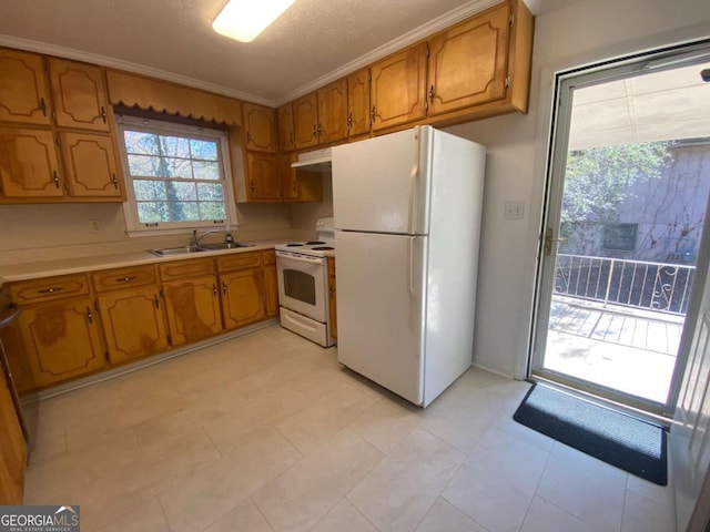 kitchen with a textured ceiling, white appliances, crown molding, sink, and light tile patterned floors