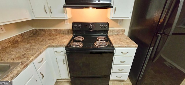 kitchen with white cabinetry, light tile patterned floors, black appliances, and range hood